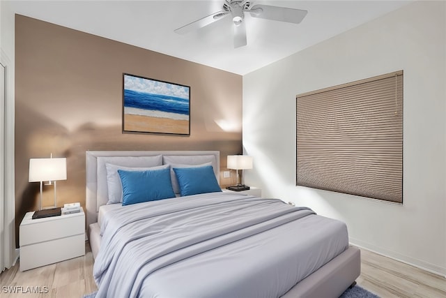 bedroom featuring light wood-type flooring and ceiling fan