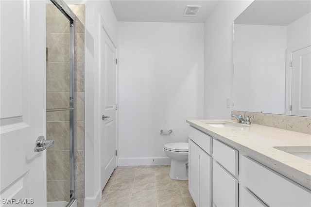 bathroom with walk in shower, tile patterned flooring, vanity, and toilet