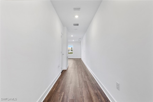 hall with dark wood-type flooring