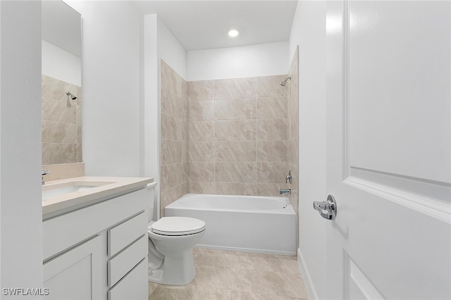 full bathroom with vanity, toilet, and tiled shower / bath