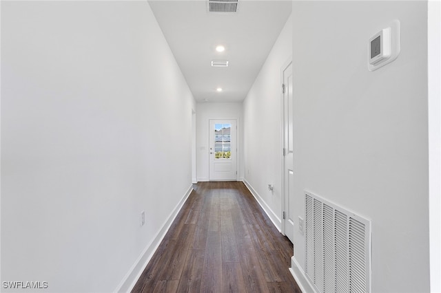 hallway with dark hardwood / wood-style floors