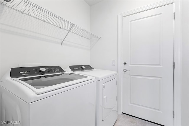 laundry room featuring washer and clothes dryer