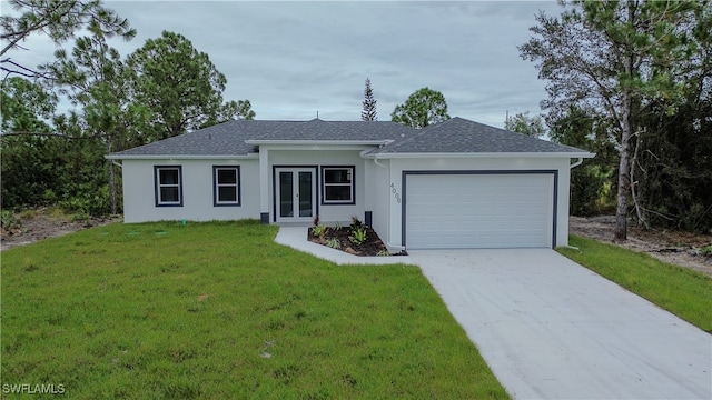 ranch-style home featuring a front lawn and a garage