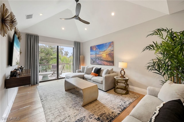 living room featuring light hardwood / wood-style flooring, ceiling fan, and lofted ceiling