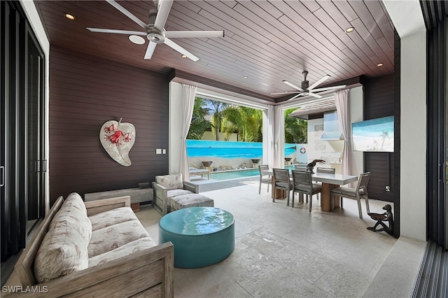 view of patio with ceiling fan, a swimming pool, and an outdoor hangout area