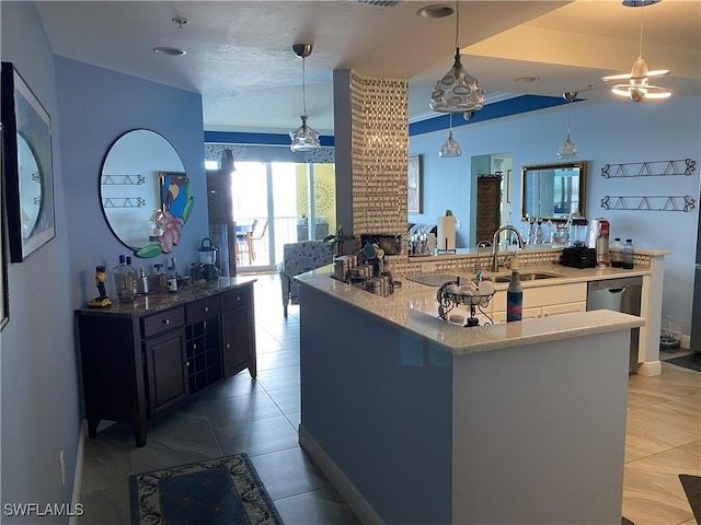 kitchen with sink, stainless steel dishwasher, a kitchen island, light tile patterned flooring, and decorative light fixtures