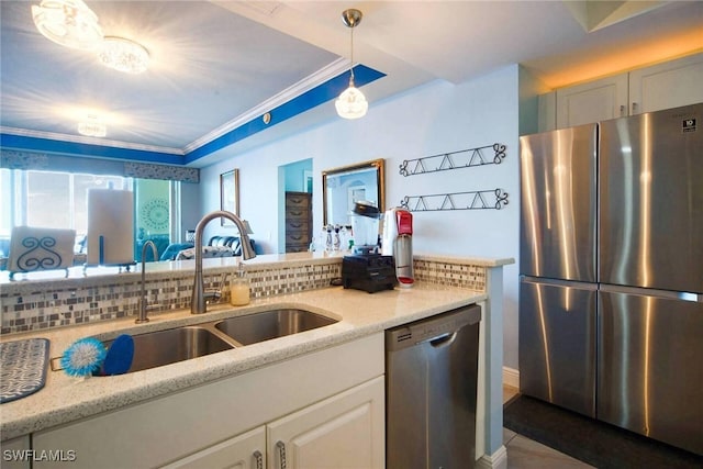 kitchen with stainless steel appliances, light stone countertops, plenty of natural light, and decorative light fixtures