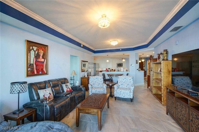 tiled living room with a raised ceiling and crown molding