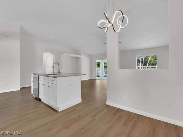 kitchen with white cabinetry, light hardwood / wood-style flooring, sink, and plenty of natural light