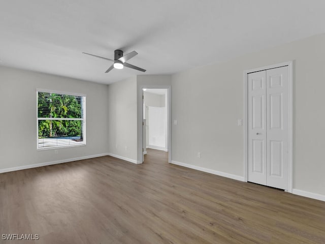 spare room featuring hardwood / wood-style flooring and ceiling fan