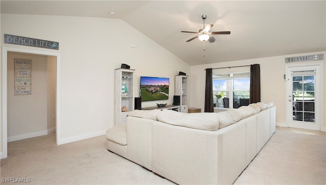 living room featuring ceiling fan, light colored carpet, and lofted ceiling