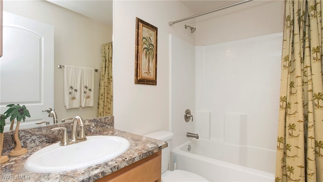 full bathroom with shower / tub combo with curtain, vanity, and toilet