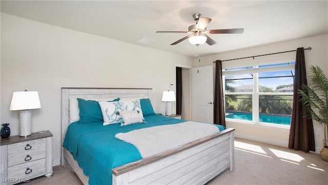 bedroom with light colored carpet and ceiling fan