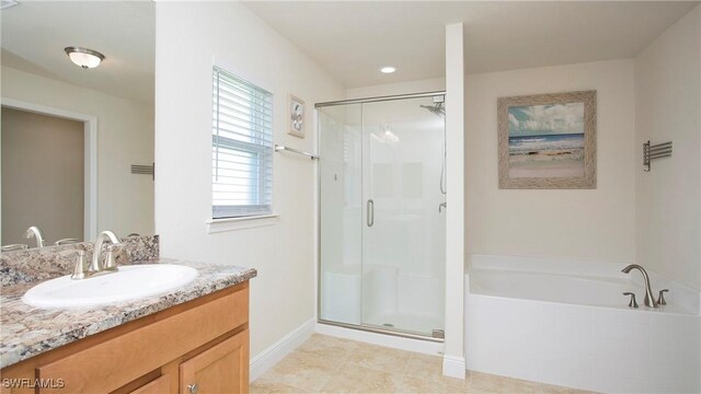 bathroom with tile patterned flooring, vanity, and independent shower and bath