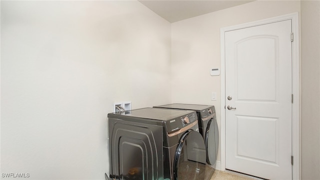 laundry area featuring washing machine and dryer