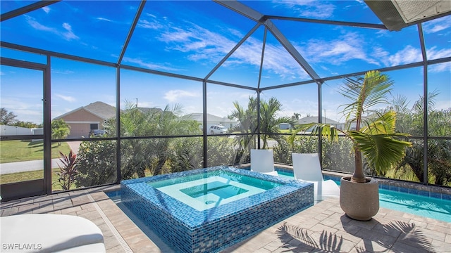 view of patio featuring a pool with hot tub and a lanai