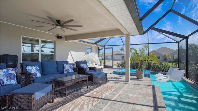 view of patio with outdoor lounge area, glass enclosure, and ceiling fan