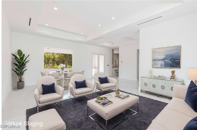 living room featuring a tray ceiling