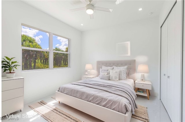 bedroom featuring ceiling fan and a closet