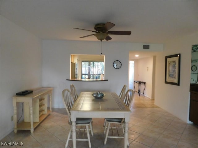 dining room featuring ceiling fan and light tile patterned floors