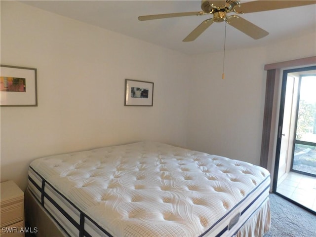 unfurnished bedroom featuring light carpet, access to exterior, and ceiling fan