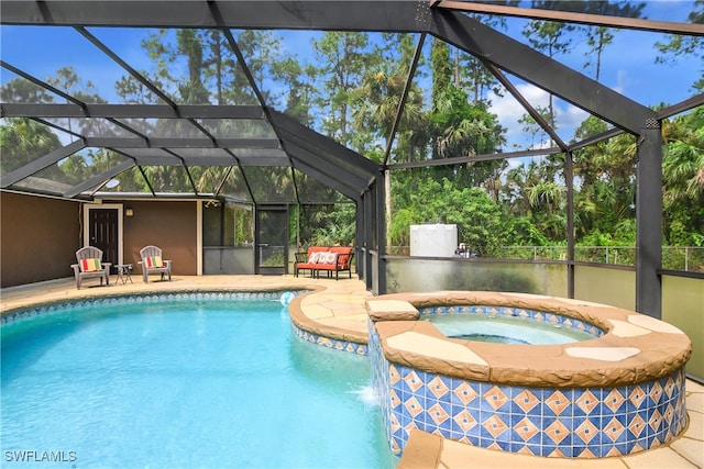 view of swimming pool with a patio, an in ground hot tub, and a lanai