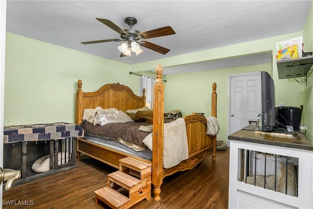 bedroom featuring ceiling fan and dark hardwood / wood-style flooring