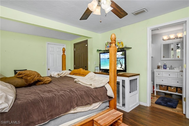 bedroom featuring ceiling fan, sink, and dark hardwood / wood-style flooring