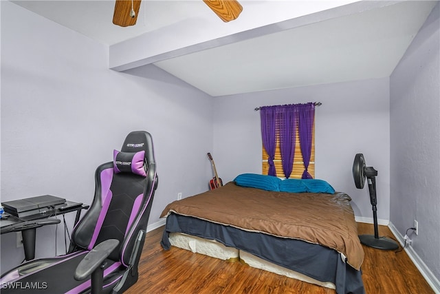 bedroom featuring lofted ceiling with beams, hardwood / wood-style floors, and ceiling fan