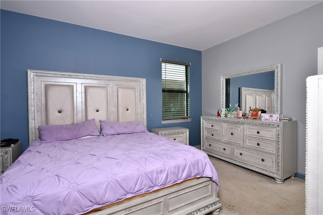 bedroom with light carpet