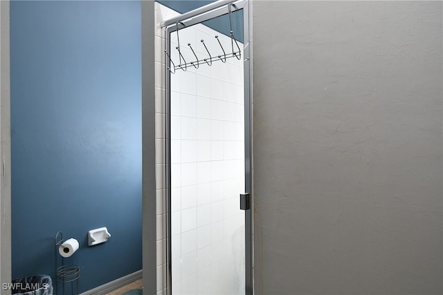 room details featuring a shower with shower door