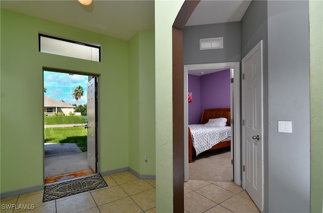 foyer entrance featuring light tile patterned flooring