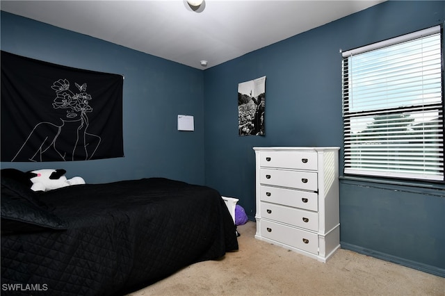 bedroom with light colored carpet