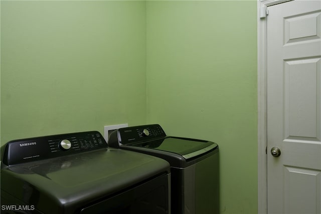 laundry area with separate washer and dryer