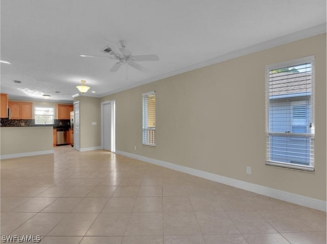 unfurnished living room with ceiling fan, light tile patterned flooring, and ornamental molding