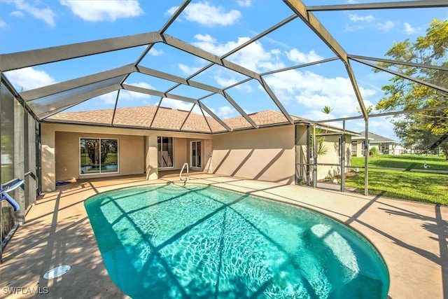 view of swimming pool featuring glass enclosure and a patio