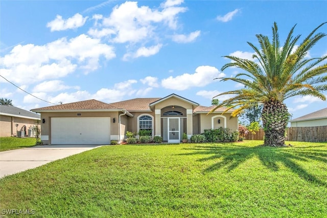 view of front facade featuring a front lawn and a garage