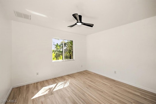 unfurnished room with ceiling fan and light wood-type flooring