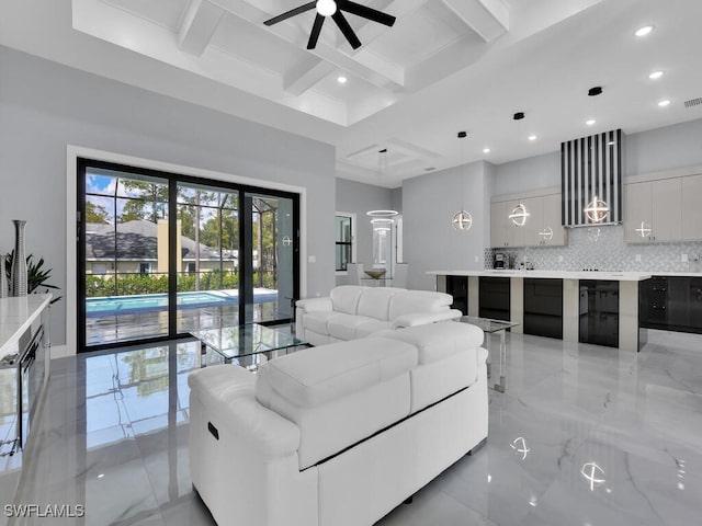 living room featuring beam ceiling and ceiling fan