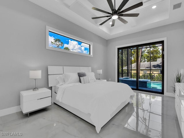 bedroom featuring a raised ceiling, access to outside, and ceiling fan