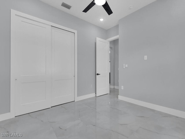 unfurnished bedroom with a closet and ceiling fan