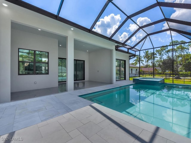 view of pool featuring a patio and glass enclosure