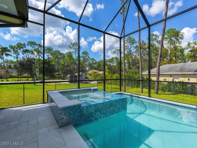 view of pool featuring an in ground hot tub, glass enclosure, and a lawn