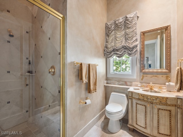 bathroom with toilet, vanity, and walk in shower