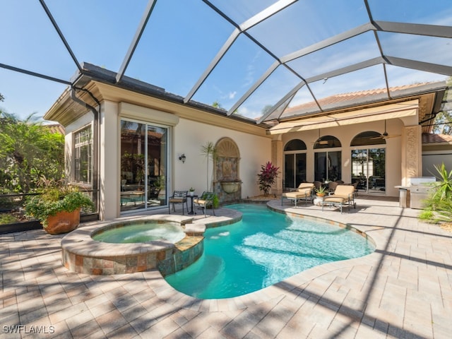 view of pool featuring ceiling fan, a lanai, an in ground hot tub, and a patio