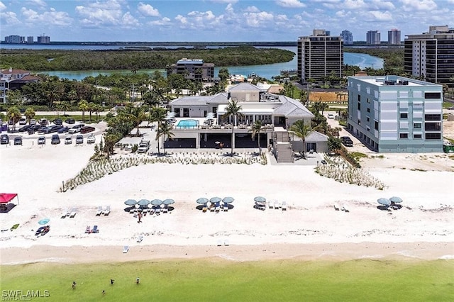 aerial view with a beach view and a water view