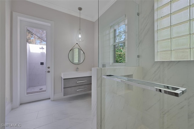 bathroom featuring a shower with door, crown molding, a healthy amount of sunlight, and vanity