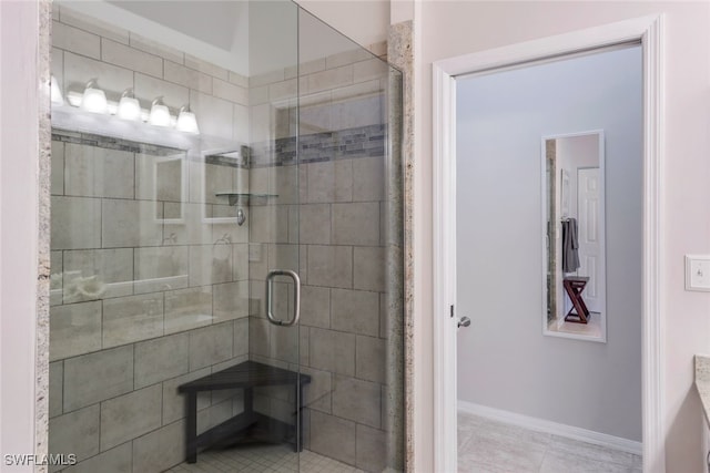 bathroom with tile patterned flooring and an enclosed shower