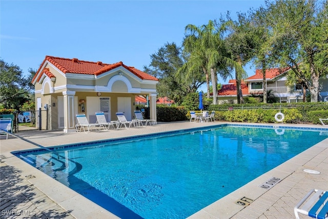 view of swimming pool featuring a patio