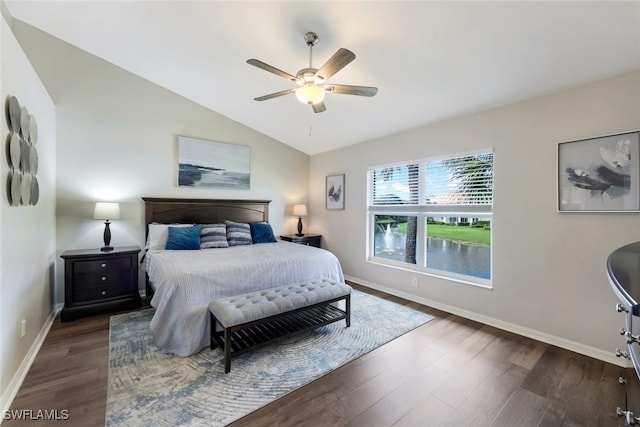 bedroom featuring ceiling fan, lofted ceiling, and dark hardwood / wood-style flooring